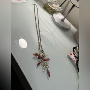 Li Sophia Matte Gold Necklace with pink/burgundy tone stones.